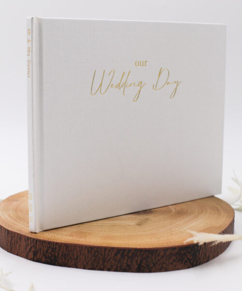 Wedding book showing 'Our Wedding Day' in foil with txt on the spine