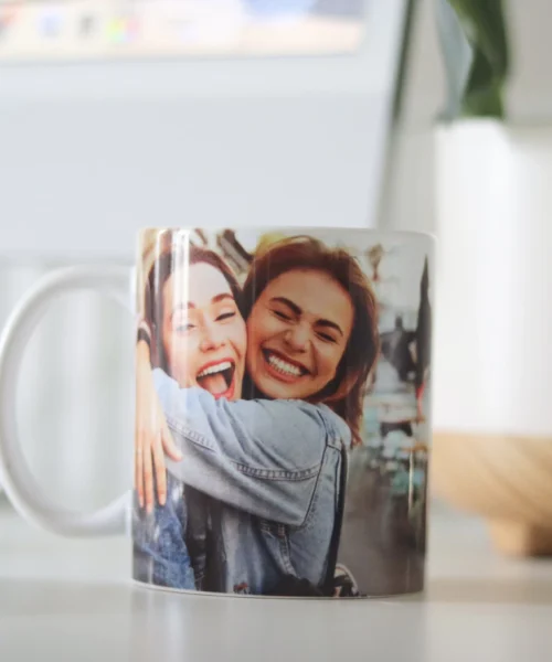 A mug with a photo of two people hugging