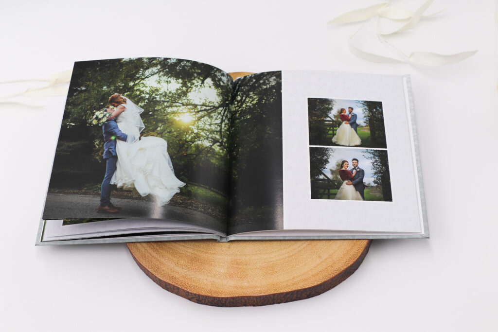 Open wedding book showing two pictures of a wedding